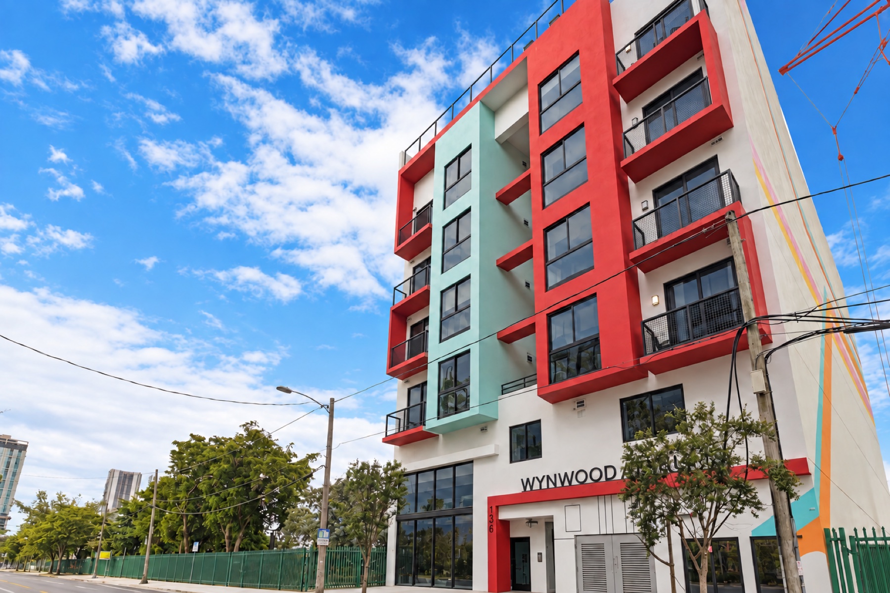 Retouched exterior of Wynwood Atriums, showing its colorful facade and entrance